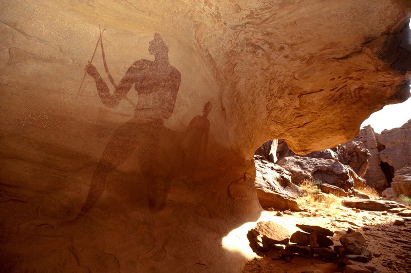 Djanet, Algeria. Paintings of two large men on back wall of shelter. Image ID: algdja0040001