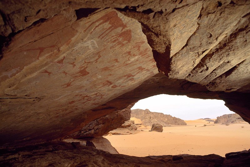 Tadrart, Algeria. View from Cattle Cave. Cave entrance is about five metres above desert floor. Cave is about six metres deep, has stone floor, arched roof and is well protected. Image ID: algtdr0030002