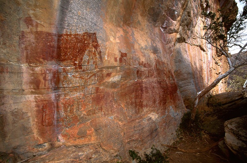 Tsodilo Hills. Looking past rock paintings and along cliff face.Image ID: bottsd0310003