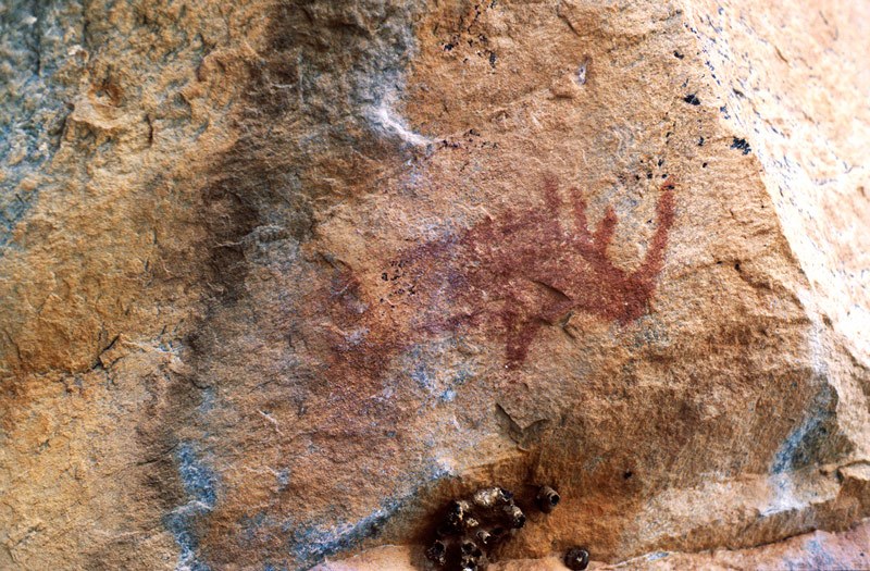 Tsodilo Hills. Small red rhinoceros facing right. Image ID: bottsd0810001