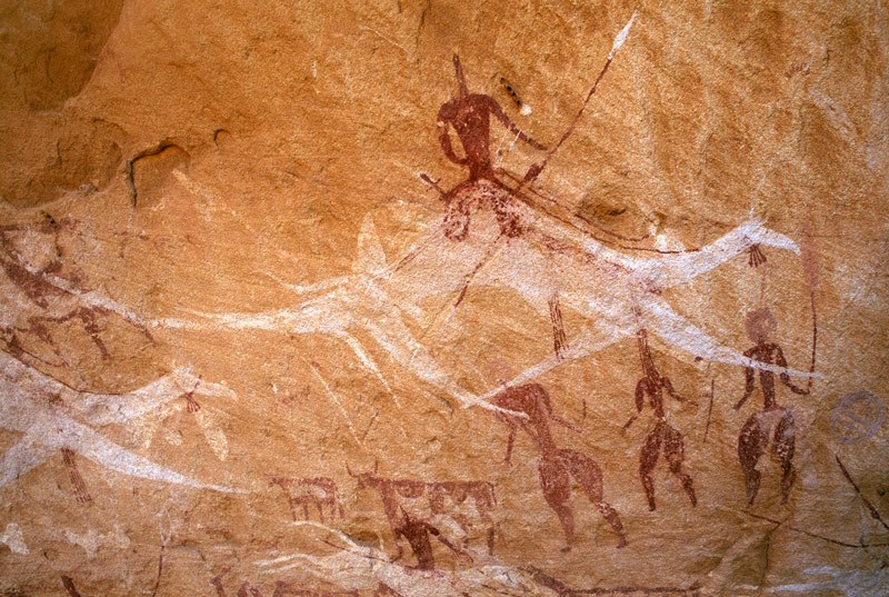 Ennedi plateau. Flying white camel mounted by armed warrior. Image ID: chaenp0050035