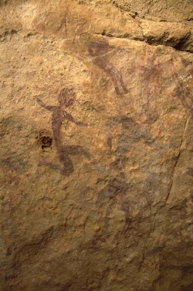 Jebel Uweynant. Faded red figure superimpose. Large naked man with round head. ID: egykta0030002