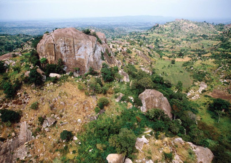 Mount Elgon. Chelelemuk Hills. Kakapel Shelter is hidden behind the right face of the foreground granite inselberg. Image ID: kenmte0010021