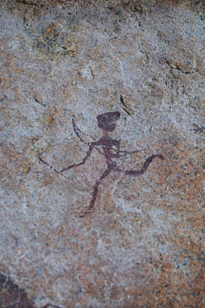 A small figure runs to the left holding a bow in its hand