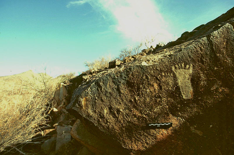 Foot engraving rising out of a gorge in Damaraland