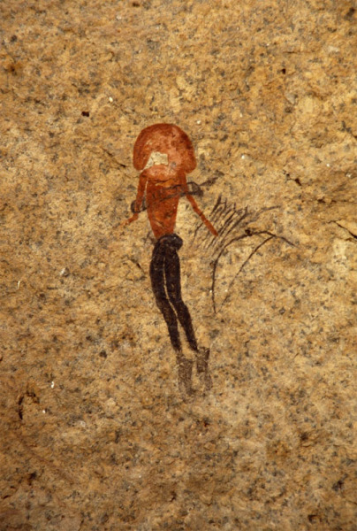 polychrome red, blue-black and white figure facing forward and holding a quiver in the left hand