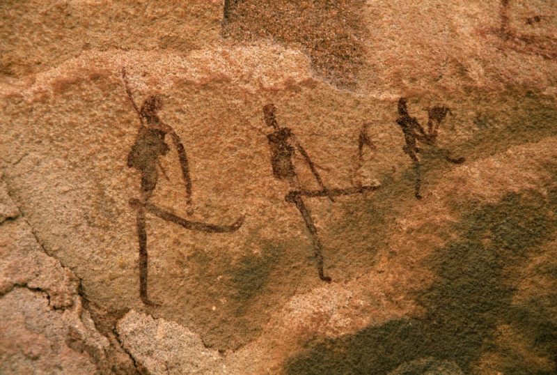 Painted figures with their legs up-perhaps dancing. Some of the only painted art in an area full of engravings (Twyfelfontein)