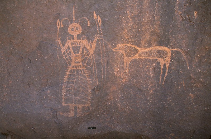 Western Air Mountains, Niger. Panel below waterfall of engraved horses mounted by schematic thin figures, polished outlines. Note damage caused by residue of chemical latex used to mould engravings. Horse/Camel Period. Image ID: nigwam0130006