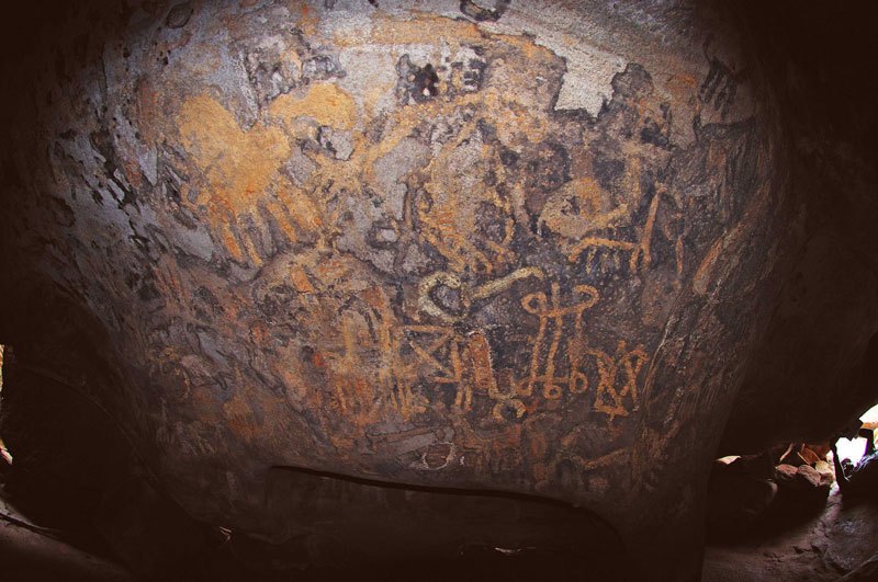 Dhayamole. Possible camel at top left, giraffes and complicated symbols. Image ID: somdha0020009