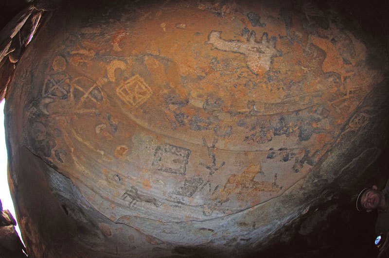 Dhayamole. Fish-eye views of sections of a different panel. From top, black, upside-down animal. Black, striding figures. Decorated square. Image ID: somdha0020028