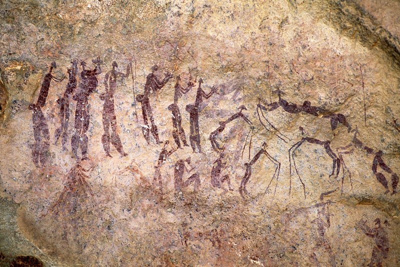 Dancers supported on sticks and people standing clapping. Image ID: soaefs0010015
