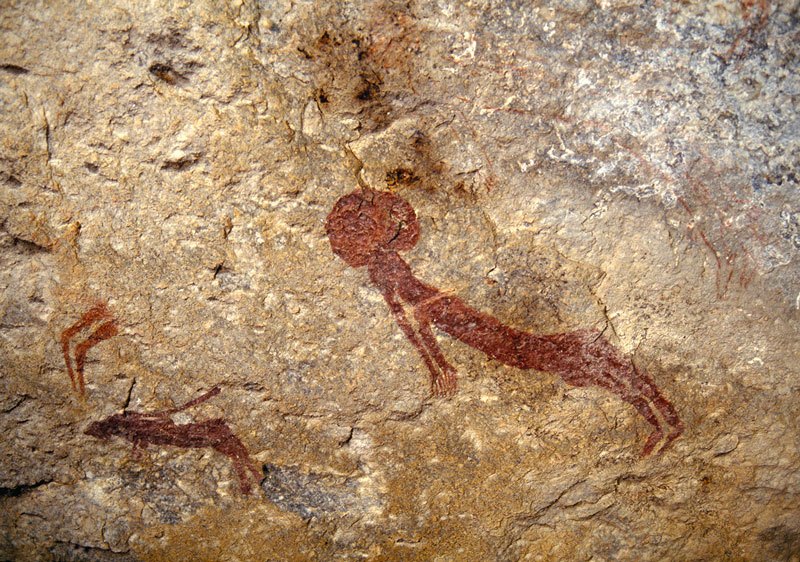 Main floating figure with, to its left, smaller floating figure above running predator and below antelope. Image ID: tankon0100006