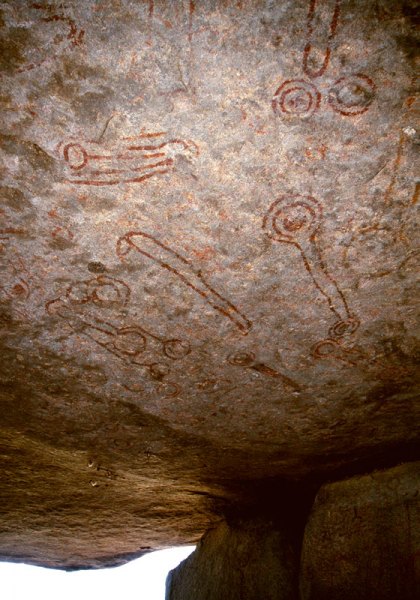 Lake Victoria, Uganda. Paintings in red and originally in-filled in white cover the underside of a boulder forming the roof to a shelter. The art is attributed to Twa peoples. The age of the paintings is uncertain. Image ID: ugavic0060005