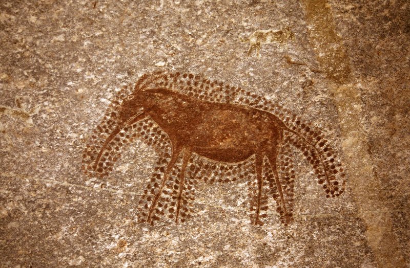 Mashonaland, Zimbabwe. Antbear facing left with body, head and tail surrounded by double row of dots and legs surrounded by single row of dots. Image ID: zimmsl0010017