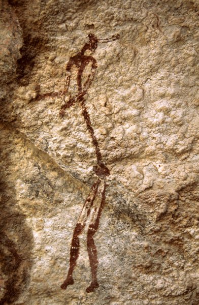 Mashonaland, Zimbabwe. Maroon and white man. Note elongation and multiple decorations on head, arms and legs. Image ID: zimmsl0060012